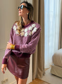 Mini-jupe Alma en simili cuir bordeaux avec short intégré et passants de ceinture – Siamoise